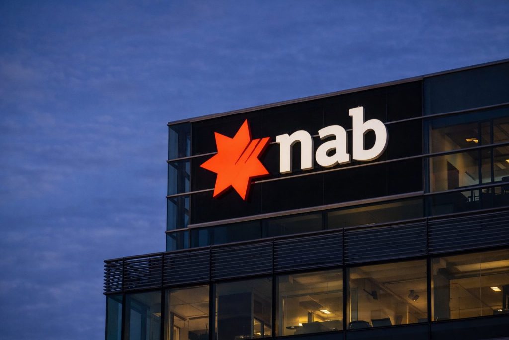 NAB share price slides after GDP surprise and oil spike puts RBA hike back in play