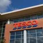 Tesco Rises After Buyback; UK Grocery Market in Spotlight