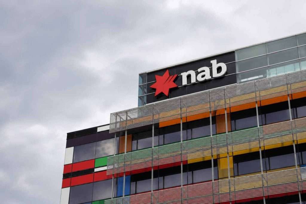 NAB shares edge up after deposit hedge balances loan margin hit