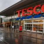 Tesco trades higher as repurchase hits 59% of target, grocery share cools