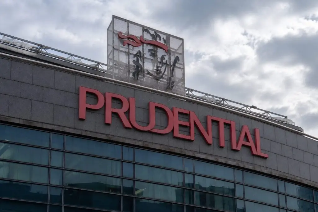 Prudential trades lower while shares buyback tops market price