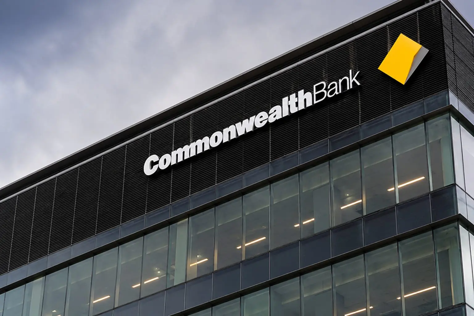 Commonwealth Bank stock rises as ASX falls, premium valuation faces rate test