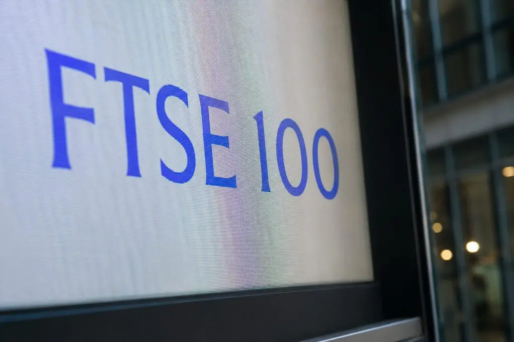 FTSE 100 edges up, but UK mid-caps slide after credit worries